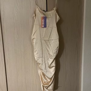 I am selling a dress, Brand is SHEIN, Color is beige,Size is large.